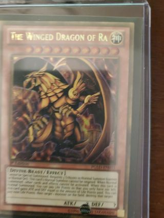 Yugioh Gold Secret Rare The Winged Dragon Of Ra Pgld - En031 1st Edition Near