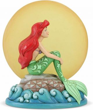 Ariel Sitting On Rock By Moon Statue